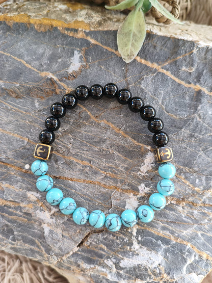 Pulsera "Pacific Anchor" – Turquesa, Ónix y Detalles Dorados